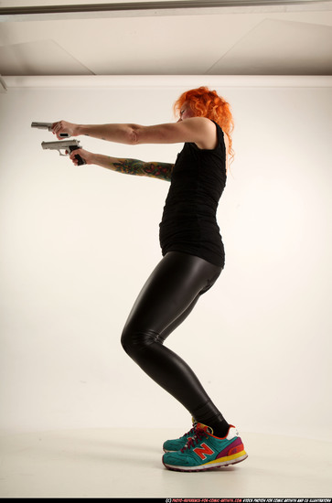 Woman Adult Athletic White Fighting with gun Standing poses Casual