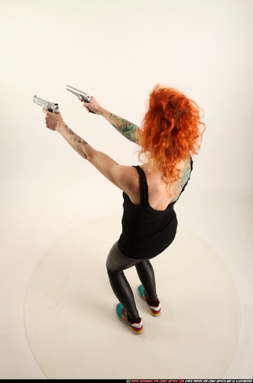 Woman Adult Athletic White Fighting with gun Standing poses Casual