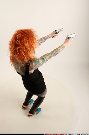 Woman Adult Athletic White Fighting with gun Standing poses Casual