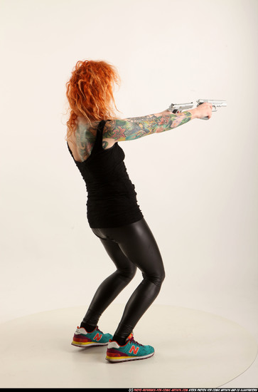 Woman Adult Athletic White Fighting with gun Standing poses Casual