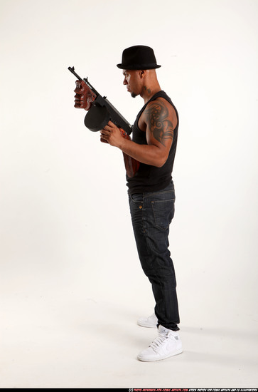 Man Adult Athletic Black Fighting with submachine gun Standing poses Casual