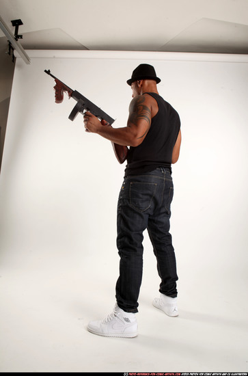 Man Adult Athletic Black Fighting with submachine gun Standing poses Casual