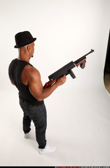 Man Adult Athletic Black Fighting with submachine gun Standing poses Casual