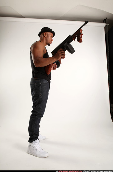 Man Adult Athletic Black Fighting with submachine gun Standing poses Casual