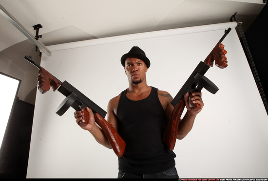 Man Adult Athletic Black Fighting with submachine gun Standing poses Casual