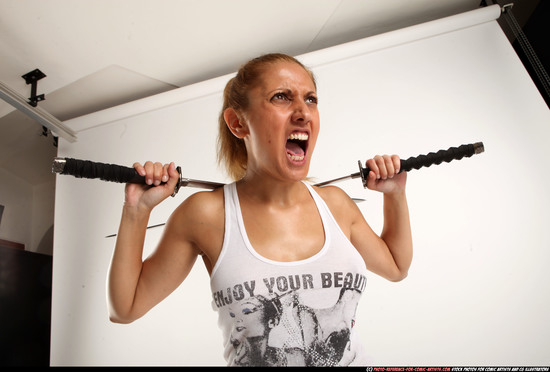 Woman Adult Athletic White Fighting with sword Standing poses Casual