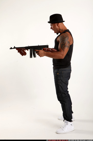 Man Adult Athletic Black Fighting with submachine gun Standing poses Casual