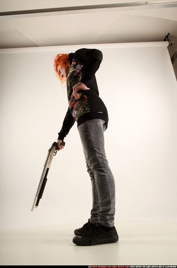 Woman Adult Athletic White Standing poses Casual Fighting with shotgun