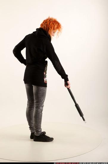 Woman Adult Athletic White Standing poses Casual Fighting with shotgun