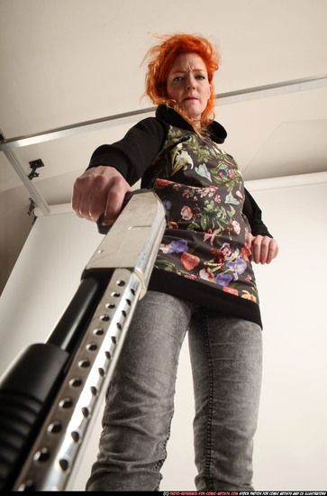 Woman Adult Athletic White Standing poses Casual Fighting with shotgun