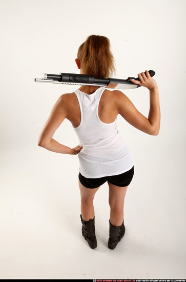 Woman Adult Athletic White Standing poses Casual Fighting with shotgun