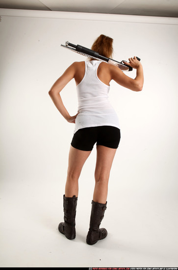 Woman Adult Athletic White Standing poses Casual Fighting with shotgun