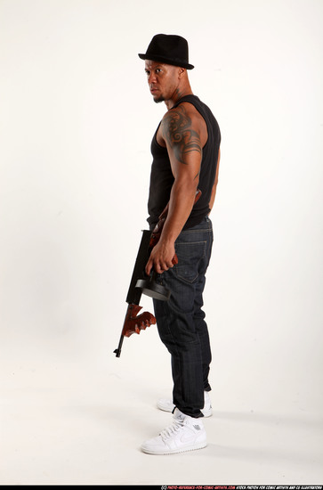 Man Adult Athletic Black Fighting with submachine gun Standing poses Casual