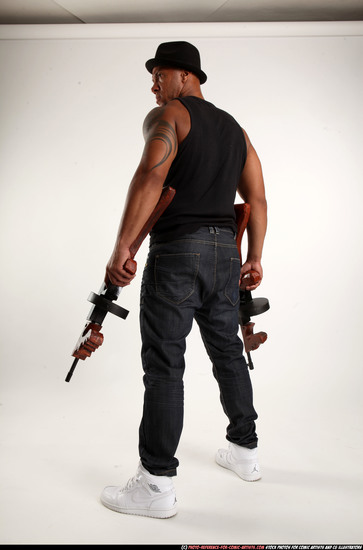 Man Adult Athletic Black Fighting with submachine gun Standing poses Casual