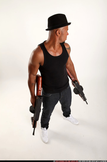 Man Adult Athletic Black Fighting with submachine gun Standing poses Casual