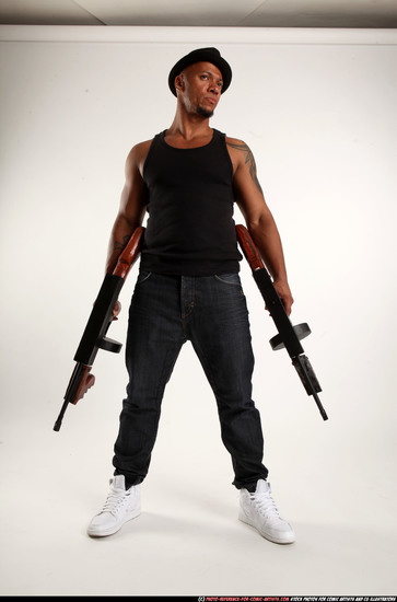 Man Adult Athletic Black Fighting with submachine gun Standing poses Casual