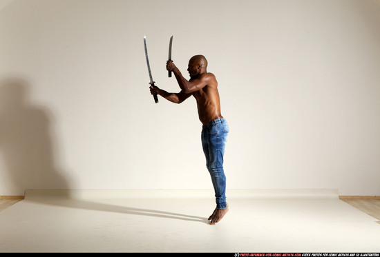 Man Adult Athletic Black Fighting with sword Moving poses Pants