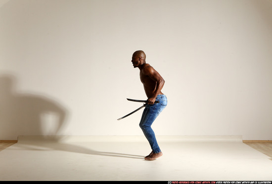 Man Adult Athletic Black Fighting with sword Moving poses Pants