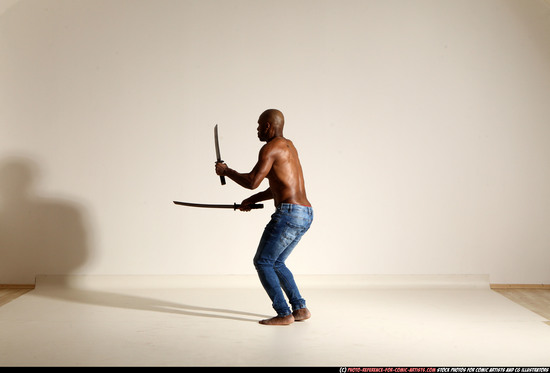 Man Adult Athletic Black Fighting with sword Moving poses Pants