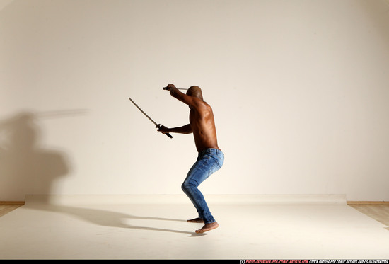 Man Adult Athletic Black Fighting with sword Moving poses Pants