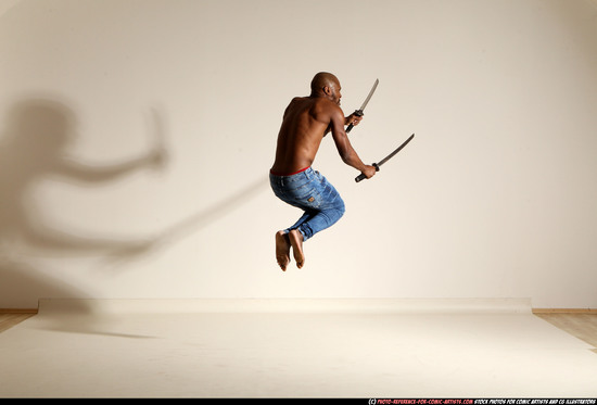 Man Adult Athletic Black Fighting with sword Moving poses Pants