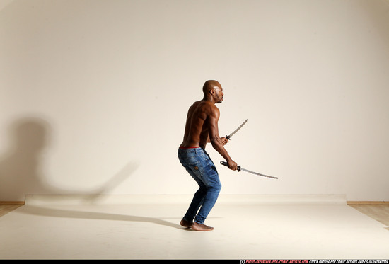 Man Adult Athletic Black Fighting with sword Moving poses Pants