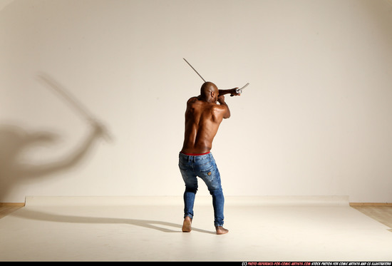 Man Adult Athletic Black Fighting with sword Moving poses Pants