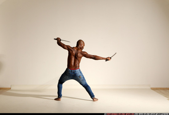 Man Adult Athletic Black Fighting with sword Moving poses Pants