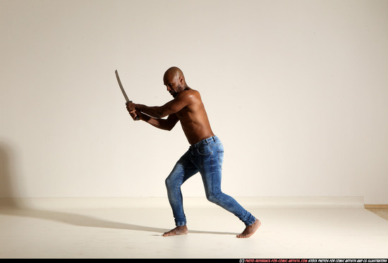 Man Adult Athletic Black Fighting with sword Moving poses Pants