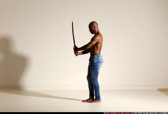 Man Adult Athletic Black Fighting with sword Moving poses Pants