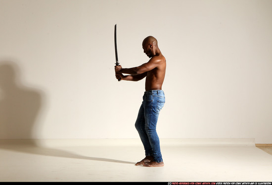 Man Adult Athletic Black Fighting with sword Moving poses Pants