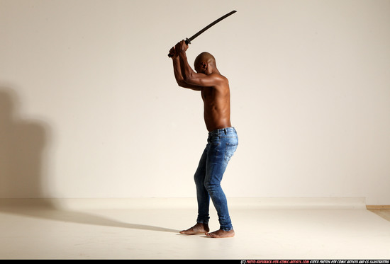 Man Adult Athletic Black Fighting with sword Moving poses Pants