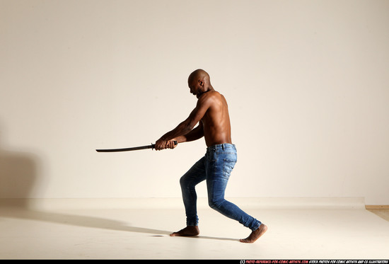 Man Adult Athletic Black Fighting with sword Moving poses Pants