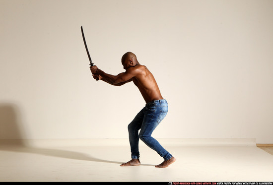 Man Adult Athletic Black Fighting with sword Moving poses Pants