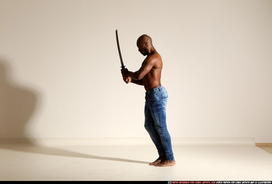 Man Adult Athletic Black Fighting with sword Moving poses Pants