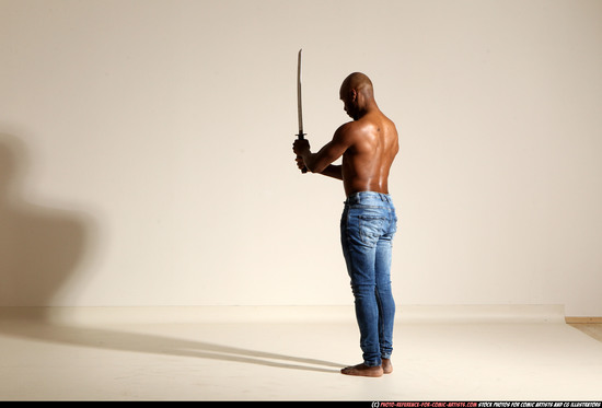 Man Adult Athletic Black Fighting with sword Moving poses Pants