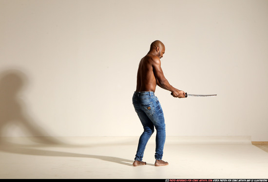 Man Adult Athletic Black Fighting with sword Moving poses Pants