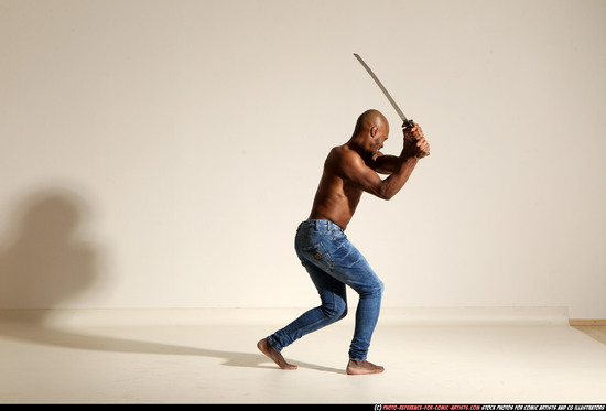 Man Adult Athletic Black Fighting with sword Moving poses Pants