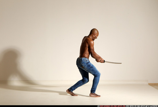 Man Adult Athletic Black Fighting with sword Moving poses Pants