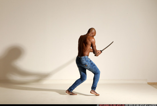 Man Adult Athletic Black Fighting with sword Moving poses Pants