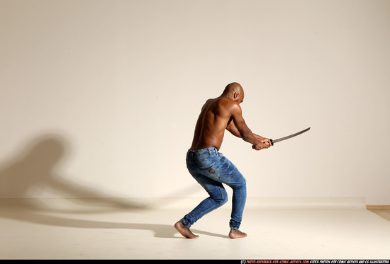 Man Adult Athletic Black Fighting with sword Moving poses Pants