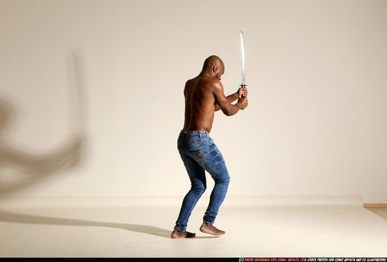 Man Adult Athletic Black Fighting with sword Moving poses Pants