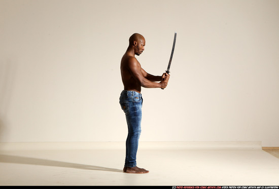 Man Adult Athletic Black Fighting with sword Moving poses Pants