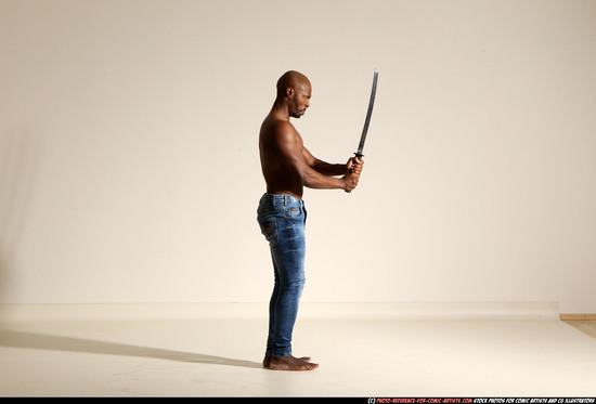 Man Adult Athletic Black Fighting with sword Moving poses Pants