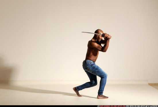 Man Adult Athletic Black Fighting with sword Moving poses Pants