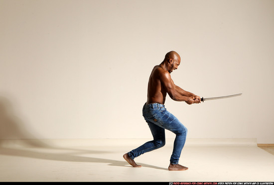 Man Adult Athletic Black Fighting with sword Moving poses Pants