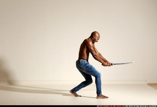 Man Adult Athletic Black Fighting with sword Moving poses Pants