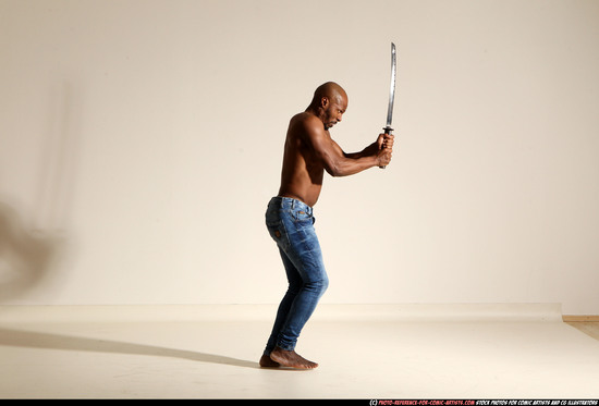 Man Adult Athletic Black Fighting with sword Moving poses Pants