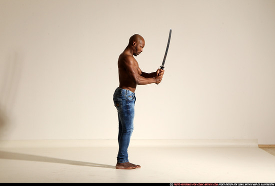 Man Adult Athletic Black Fighting with sword Moving poses Pants