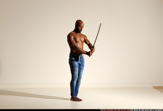 Man Adult Athletic Black Fighting with sword Moving poses Pants